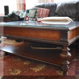 F05. Lane Furniture wooden cherry coffee table with a glass protective top. 20”h x 48”w x 28”d 